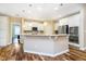 Bright kitchen with an island features white cabinets, granite countertops, and stainless steel appliances at 15506 Slateford Rd, Noblesville, IN 46062
