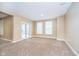 Bright living room with large windows and sliding doors, offering ample natural light at 15506 Slateford Rd, Noblesville, IN 46062