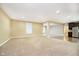 Open concept living room featuring neutral paint, carpet, and windows for natural light at 15506 Slateford Rd, Noblesville, IN 46062