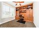 Cozy office space with custom built-in shelving and cabinets, perfect for working from home at 15506 Slateford Rd, Noblesville, IN 46062
