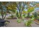 Inviting backyard patio featuring Adirondack chairs with mature trees in the background, perfect for relaxation at 1738 Pathway S Dr, Greenwood, IN 46143