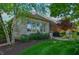 Home's backyard features a well manicured lawn, grill and plenty of seating at 1738 Pathway S Dr, Greenwood, IN 46143