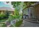 Relaxing backyard patio with green Adirondack chairs around a modern fire pit, perfect for outdoor entertaining at 1738 Pathway S Dr, Greenwood, IN 46143