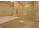 Bright bathroom features a vanity with sink and walk in shower with glass door at 1738 Pathway S Dr, Greenwood, IN 46143