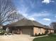 Well-maintained, single-story brick home with an attached garage and a beautifully landscaped yard at 1738 Pathway S Dr, Greenwood, IN 46143