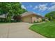 Charming single-Gathering home with a brick facade, attached garage, manicured lawn, and mature trees at 1738 Pathway S Dr, Greenwood, IN 46143