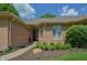 Inviting front entrance with a brick facade, manicured garden beds, and a charming entryway at 1738 Pathway S Dr, Greenwood, IN 46143
