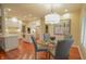 Gourmet eat-in kitchen with stainless steel appliances, a center island, and hardwood floors throughout the area at 1738 Pathway S Dr, Greenwood, IN 46143
