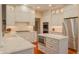 Modern kitchen with white cabinets, stainless steel appliances, island, and stylish countertops at 1738 Pathway S Dr, Greenwood, IN 46143