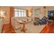 Bright living room featuring a fireplace, large windows, and comfortable seating at 1738 Pathway S Dr, Greenwood, IN 46143