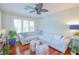 Inviting living room featuring a comfortable sectional sofa, hardwood floors, and elegant decor with natural light at 1738 Pathway S Dr, Greenwood, IN 46143