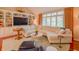 Spacious living room with built-in shelving, large windows, and comfortable seating at 1738 Pathway S Dr, Greenwood, IN 46143