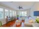 Cozy living room offers an elegant seating arrangement, hardwood floors, and decorative window shutters at 1738 Pathway S Dr, Greenwood, IN 46143