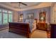 Spacious main bedroom features a trey ceiling, hardwood floors, and natural light from the window at 1738 Pathway S Dr, Greenwood, IN 46143
