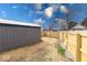 Backyard view with a storage shed and newly installed fence at 1828 Central Ave, Columbus, IN 47201