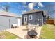 The fenced backyard includes a firepit, patio, detached garage, and updated siding at 1828 Central Ave, Columbus, IN 47201
