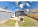 Relaxing backyard with a fire pit, patio, and a detached metal storage shed at 1828 Central Ave, Columbus, IN 47201