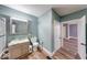 Bathroom boasts updated vanity, shower/tub combo, and stylish flooring at 1828 Central Ave, Columbus, IN 47201