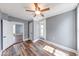 This comfortable bedroom is well-lit by natural light and features wood-grain flooring at 1828 Central Ave, Columbus, IN 47201