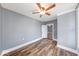 This comfortable bedroom is well-lit by natural light and features wood-grain flooring at 1828 Central Ave, Columbus, IN 47201