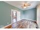 Bedroom showcasing modern flooring, soothing paint, and a ceiling fan at 1828 Central Ave, Columbus, IN 47201