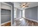 This bedroom is well-lit by natural light and features wood-grain flooring and a closet at 1828 Central Ave, Columbus, IN 47201