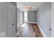 This bedroom is well-lit by natural light and features wood-grain flooring at 1828 Central Ave, Columbus, IN 47201