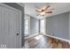 This bedroom is well-lit by natural light and features wood-grain flooring at 1828 Central Ave, Columbus, IN 47201
