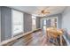 Bright and airy dining room with hardwood floors, neutral paint, and natural light at 1828 Central Ave, Columbus, IN 47201
