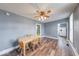 Charming dining room with hardwood floors, neutral paint, and a wooden table at 1828 Central Ave, Columbus, IN 47201