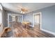 Inviting dining room with hardwood floors, neutral paint, and views into the living room at 1828 Central Ave, Columbus, IN 47201