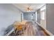 Cozy dining room with hardwood floors, neutral paint, and seating for four at 1828 Central Ave, Columbus, IN 47201