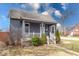 Charming home featuring a cozy front porch, freshly planted greenery and a well-maintained yard at 1828 Central Ave, Columbus, IN 47201