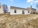 Backyard with neutral siding and a sliding glass door for indoor-outdoor flow at 1914 Kingen Dr, Greenfield, IN 46140