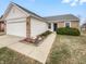 Charming single-story home with a combination of brick and vinyl siding, complemented by a two-car garage at 1914 Kingen Dr, Greenfield, IN 46140