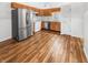 Well-equipped kitchen features stainless steel appliances, wooden cabinets, and durable flooring at 1914 Kingen Dr, Greenfield, IN 46140