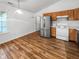 Cozy kitchen with modern appliances, wood-look flooring, and a bright window for natural light at 1914 Kingen Dr, Greenfield, IN 46140