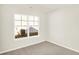 Bedroom features a window offering natural light and neutral carpet at 19599 Atwater Ave, Sheridan, IN 46069