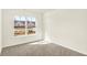 Bedroom features window offering natural light, neutral carpet, and fresh paint at 19599 Atwater Ave, Sheridan, IN 46069