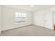 Bright bedroom features a window with views of the community and plush carpeting at 19599 Atwater Ave, Sheridan, IN 46069
