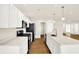 Spacious kitchen with stainless steel appliances, white cabinetry, and island sink at 19599 Atwater Ave, Sheridan, IN 46069