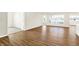 Hardwood floors throughout the living room with open doorways leading into other rooms with natural light at 19599 Atwater Ave, Sheridan, IN 46069
