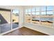 Cozy sunroom with views of the lake, adjacent to a concrete patio at 19599 Atwater Ave, Sheridan, IN 46069