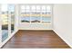 Bright sunroom with sliding glass door, lake view and three panel picture window at 19599 Atwater Ave, Sheridan, IN 46069