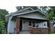 Traditional home featuring a quaint porch and a classic gable roof design at 2022 N Olney St, Indianapolis, IN 46218