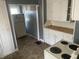 Functional kitchen featuring classic white cabinetry and essential appliances at 2022 N Olney St, Indianapolis, IN 46218