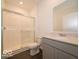 Bathroom featuring a walk-in shower with glass doors, a white toilet, and a granite vanity at 2254 Oakmont Dr, Plainfield, IN 46168