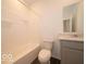 A pristine bathroom features a sleek vanity, a toilet, and a shower with tub at 2254 Oakmont Dr, Plainfield, IN 46168