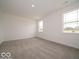 Carpeted bedroom with two large windows at 2254 Oakmont Dr, Plainfield, IN 46168