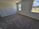Sun-filled bedroom with neutral carpeting, and bright double windows that provide a clear view of the outdoors at 2254 Oakmont Dr, Plainfield, IN 46168